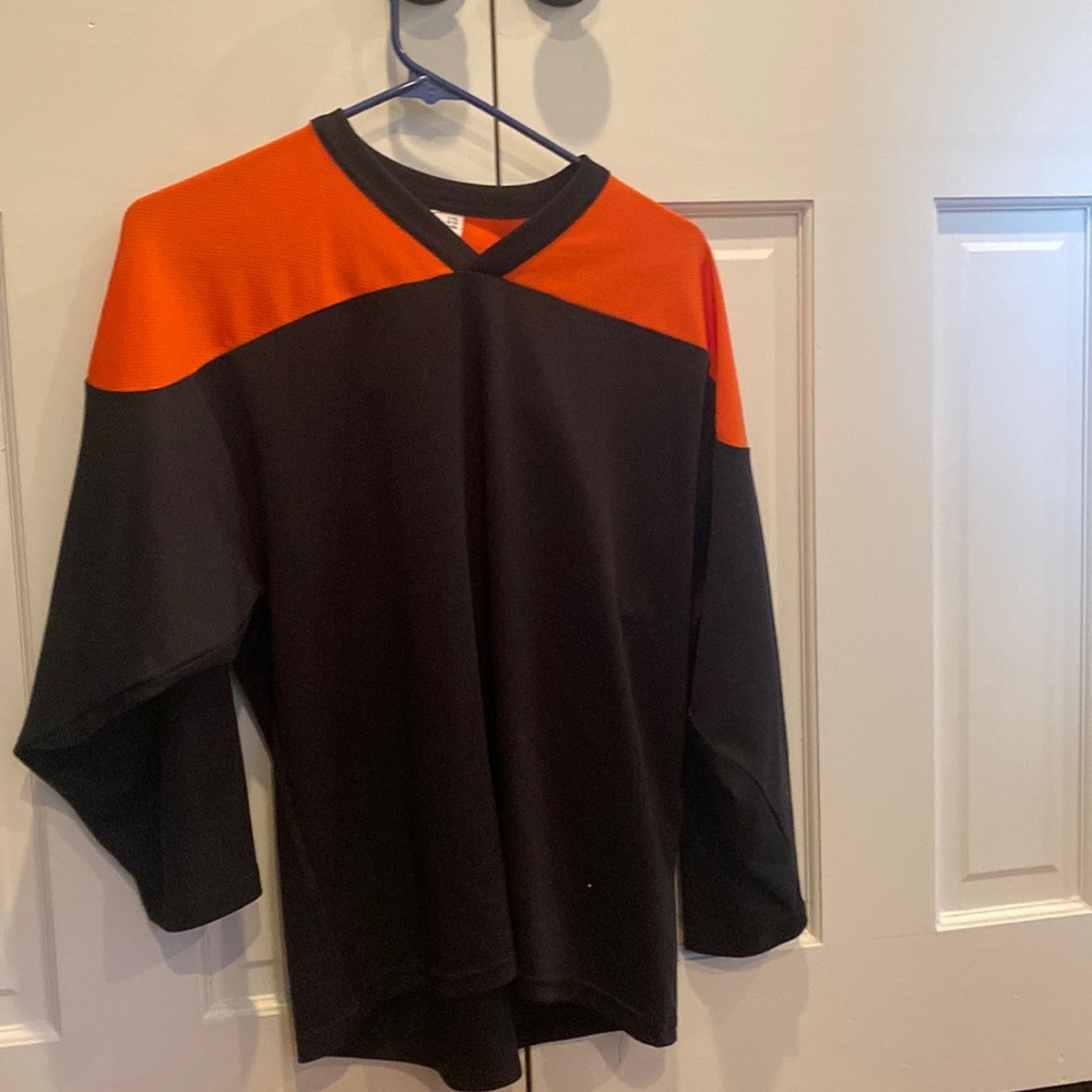 CCM black and orange practice jersey.